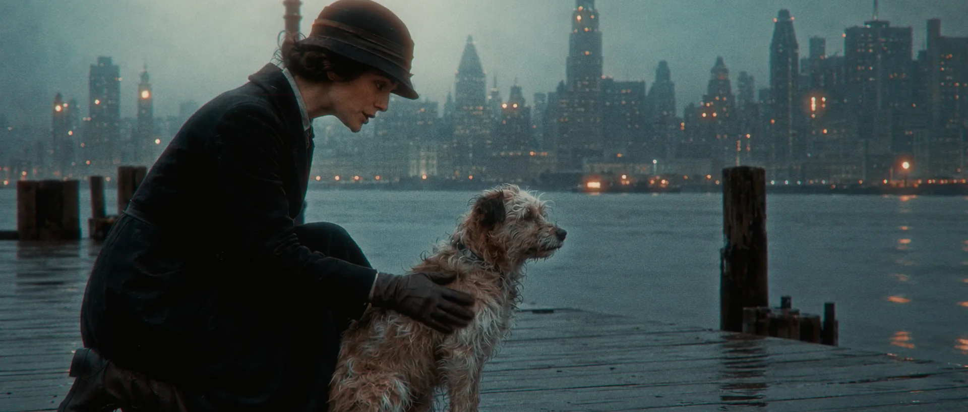 Helen kneeling beside Rags at the New York waterfront